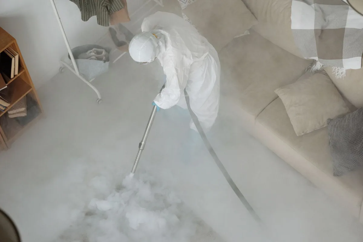 Biohazard cleanup technician in protective equipment, Barrington, NJ